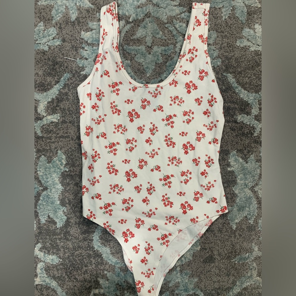 White flower pattern bodysuit , size is medium